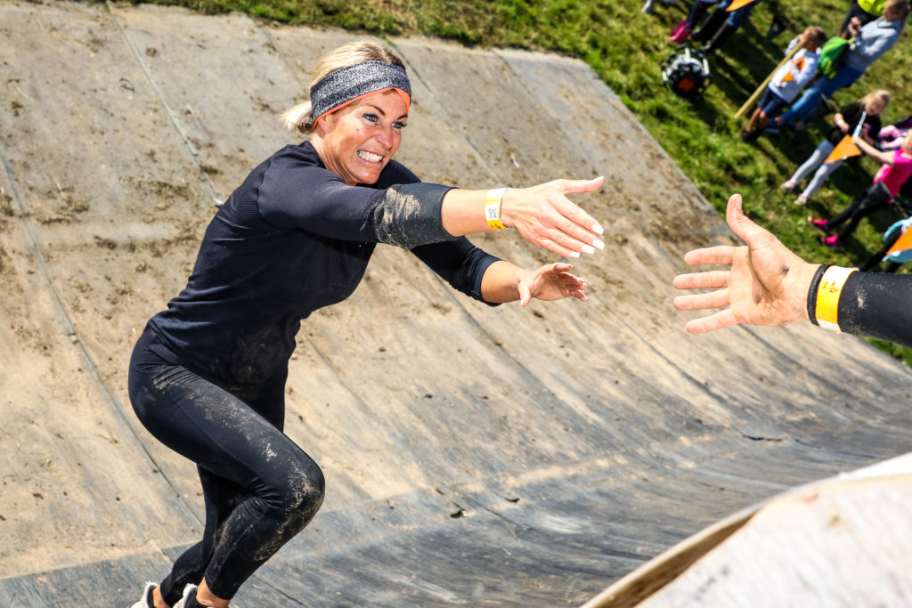 Woman running up quarter pipe