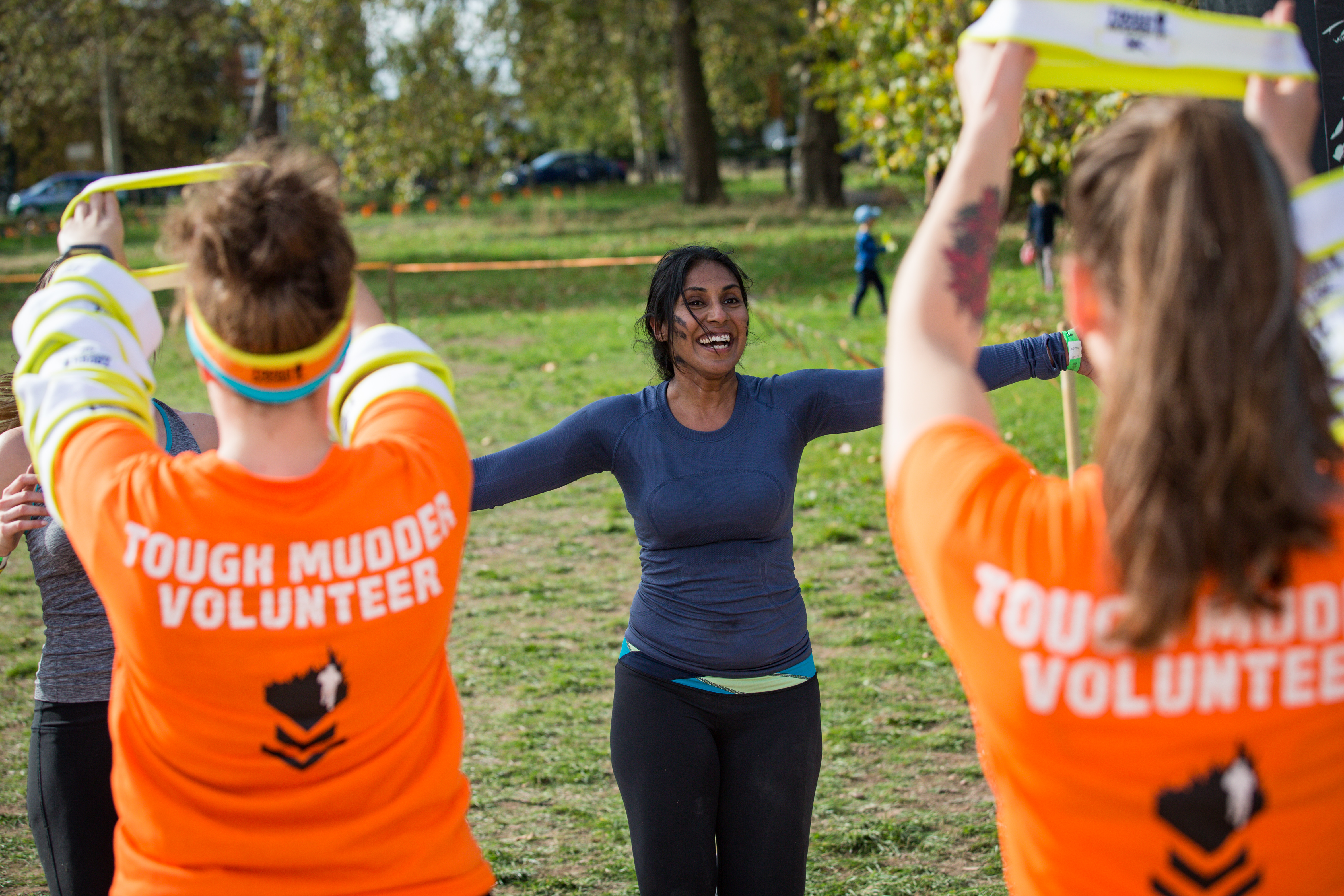 A woman runs towards people