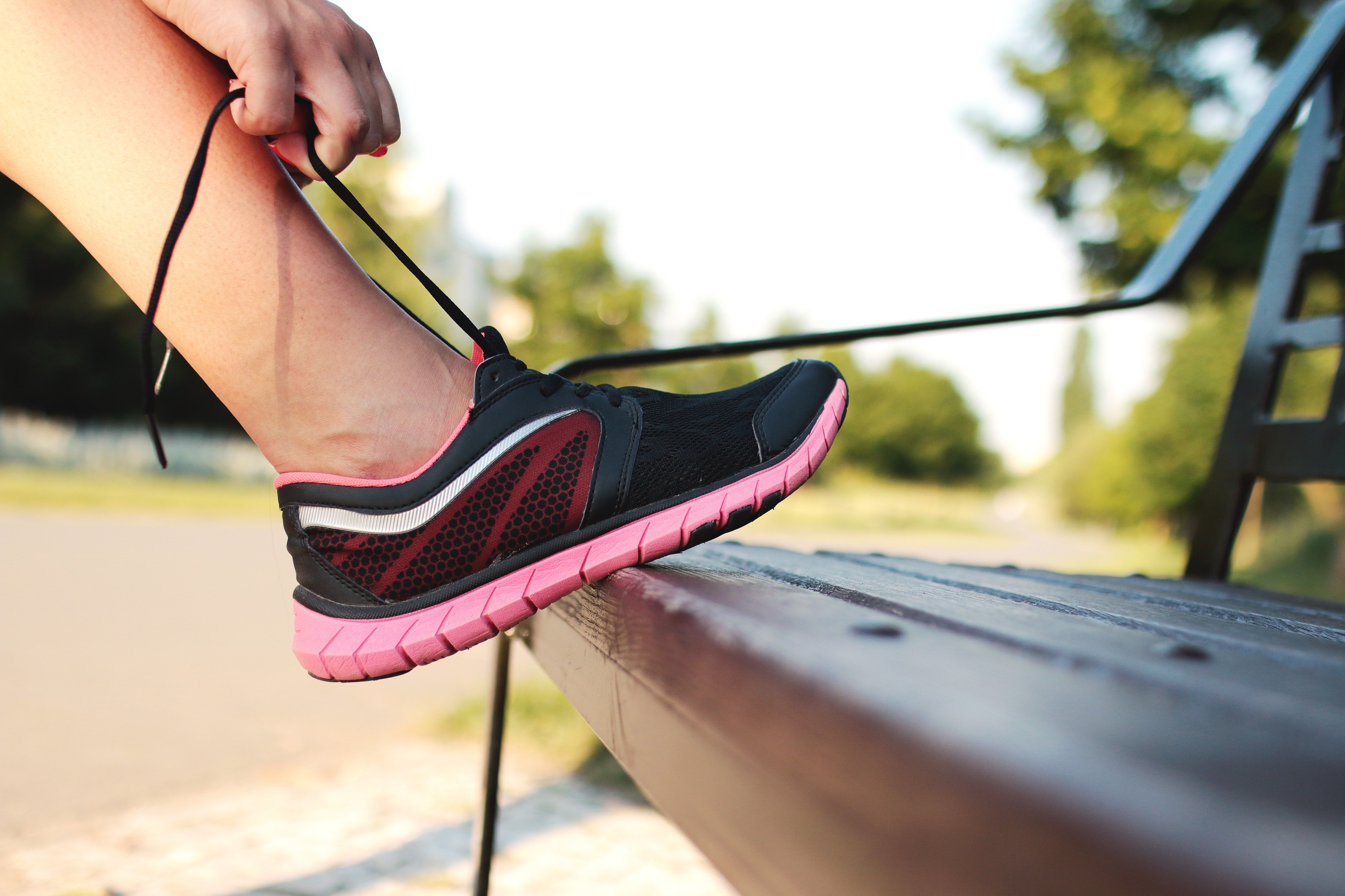 Tying shoelace on running trainer